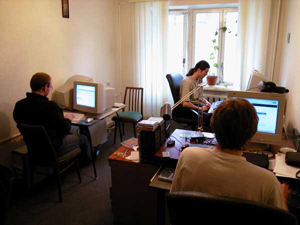The early team working at computers in a small office